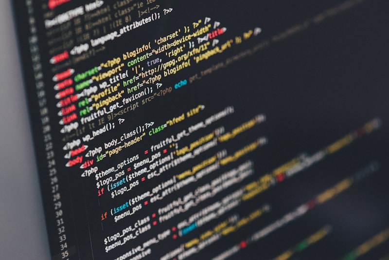 Software developer debugging code on computer screen
