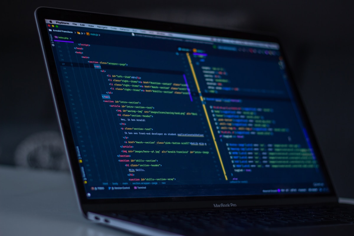 Developer working with code on screen